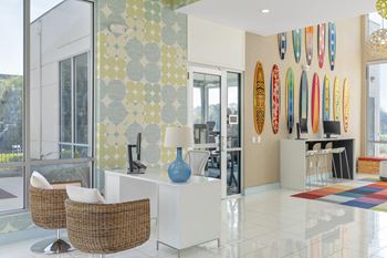 a living room with surfboards on the wall at Lakeside Villas, Orlando Florida